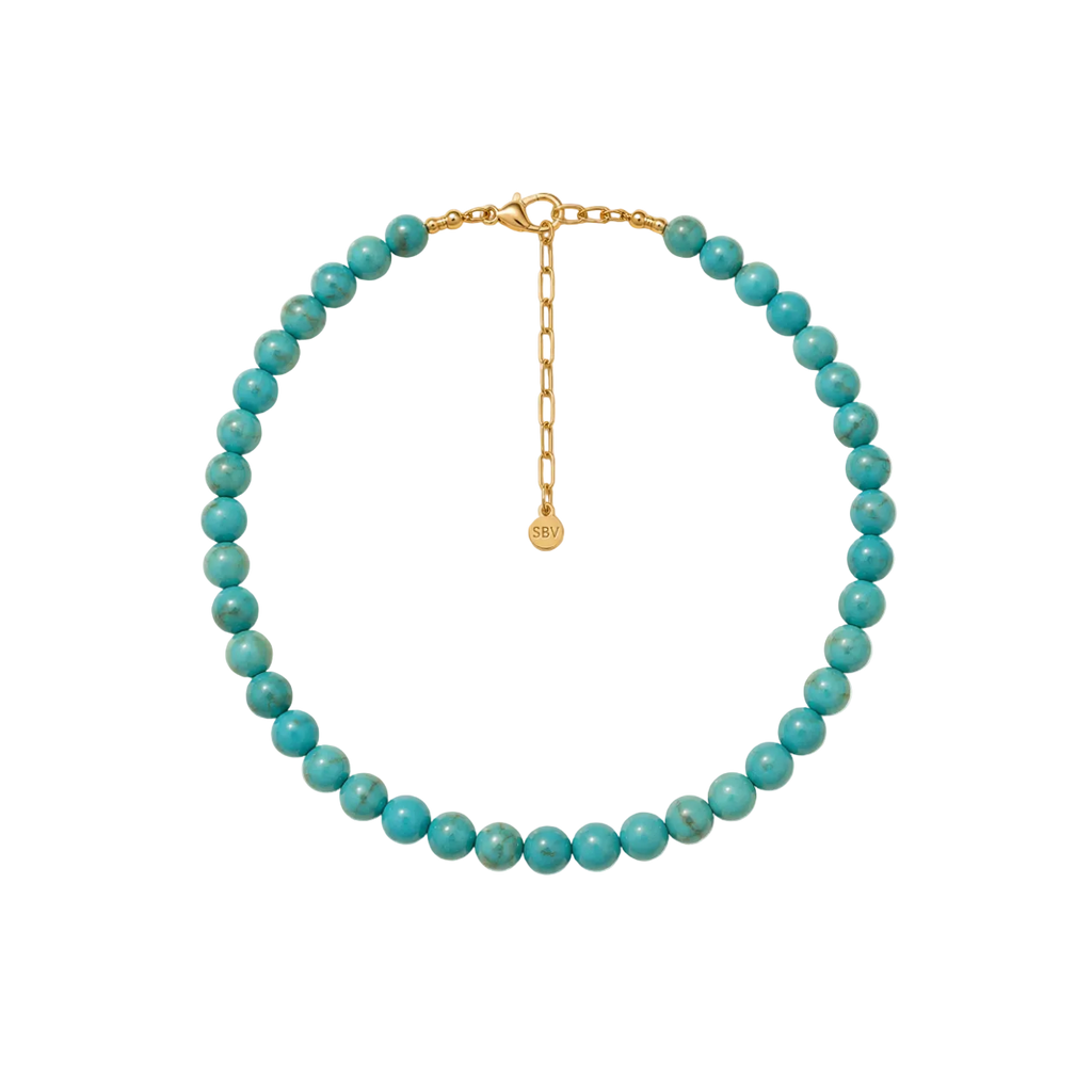 Turquoise beaded necklace with a gold clasp on a white background