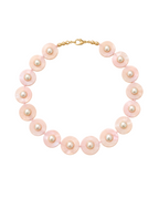 Pink pearl necklace on a white background