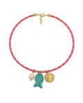 Necklace with pink cord, gold clasp, and three charms on a white background