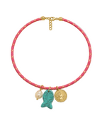 Necklace with pink cord, gold clasp, and three charms on a white background